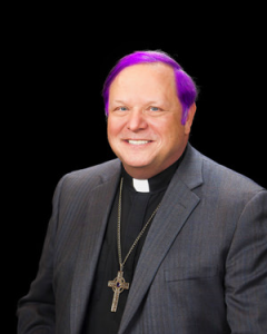 Bishop Kevin Kanouse's headshot, edited to look like his hair has been dyed purple