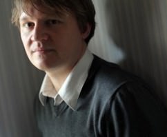 [Image description: headshot of Andrew Root, a white male with bronw hair wearing a grey sweater over a white button-down shirt.]