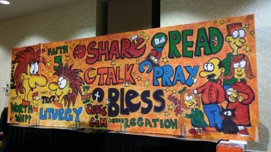[Image description: photo of a large, colorful mural-like painting. The words SHARE, READ, TALK, PRAY, and BLESS are written prominently in the center of the artwork. On the left side of the mural is a cartoon drawing of an adult and a child, facing each other; on the right side of the mural are cartoons of adults and children standing together.]